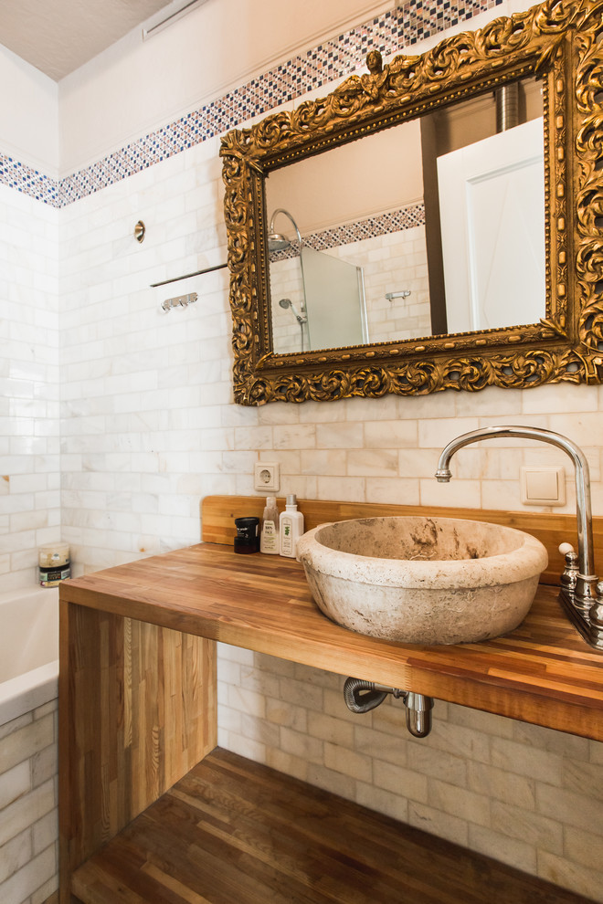 Eclectic ensuite bathroom in Moscow with open cabinets, white tiles, a vessel sink, wooden worktops and brown worktops.