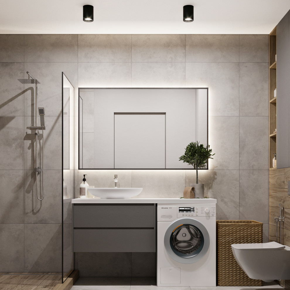 Idéer för mellanstora funkis vitt badrum med dusch, med en dusch i en alkov, en vägghängd toalettstol, grå kakel, dusch med duschdraperi, släta luckor, grå skåp, porslinskakel, grå väggar, klinkergolv i porslin, ett fristående handfat, bänkskiva i akrylsten och grått golv