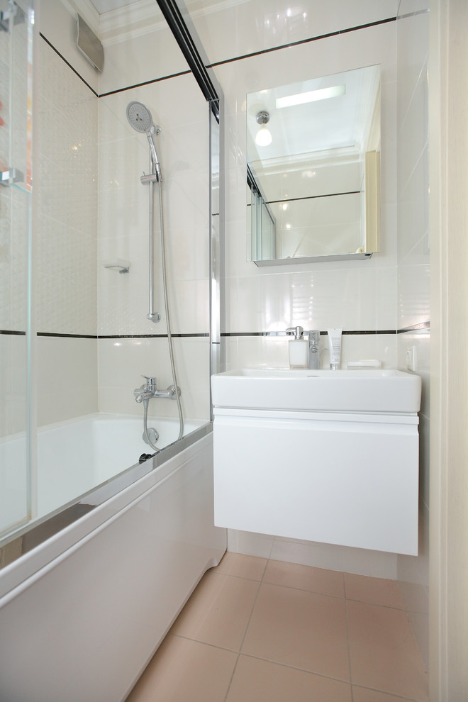 Small contemporary ensuite bathroom in Other with flat-panel cabinets, an alcove bath, white tiles, ceramic tiles, white walls, porcelain flooring, a console sink and beige floors.