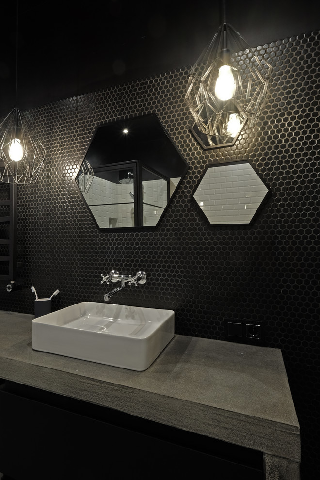 Inspiration for a mid-sized industrial black tile and ceramic tile porcelain tile and gray floor tub/shower combo remodel in Moscow with open cabinets, gray cabinets, an undermount tub, a wall-mount toilet, black walls, a drop-in sink, concrete countertops, a hinged shower door and gray countertops