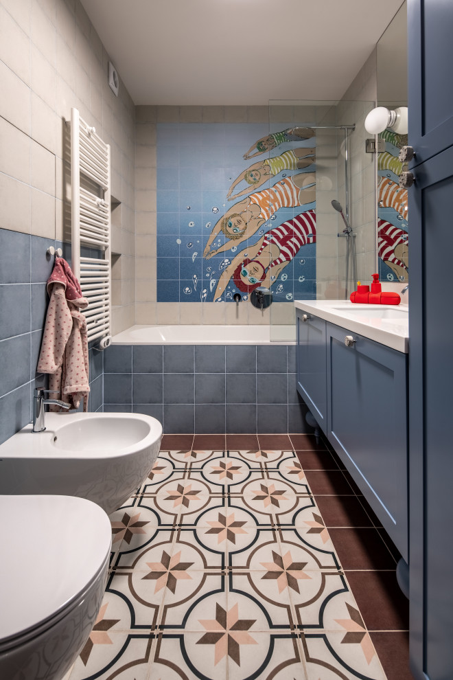 Inspiration for a large contemporary family bathroom in Other with recessed-panel cabinets, blue cabinets, a submerged bath, a bidet, blue tiles, ceramic tiles, multi-coloured walls, ceramic flooring, a submerged sink, solid surface worktops, pink floors, white worktops, a wall niche, a single sink and a freestanding vanity unit.