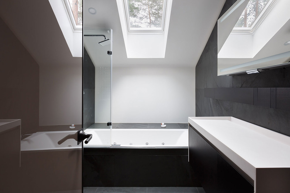 Modern ensuite bathroom in Saint Petersburg with a shower/bath combination, black tiles, flat-panel cabinets, black cabinets, a hot tub, white walls and an open shower.