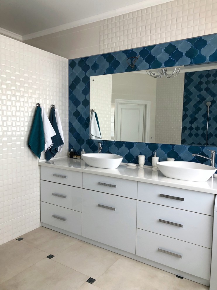 Inspiration for a mid-sized contemporary master multicolored tile and ceramic tile porcelain tile and gray floor bathroom remodel in Moscow with flat-panel cabinets, white cabinets, white walls, a vessel sink, solid surface countertops and white countertops