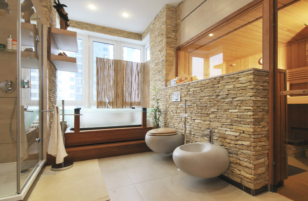 Small contemporary ensuite bathroom in Moscow with a wall mounted toilet, stone slabs, beige walls, porcelain flooring and beige floors.