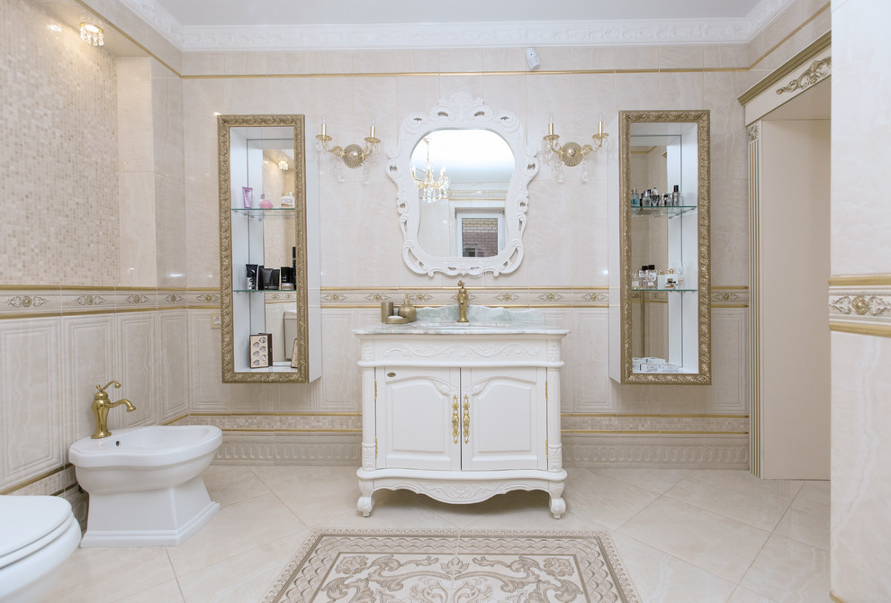 Example of a large classic master white tile and ceramic tile ceramic tile and beige floor corner bathtub design in Moscow with raised-panel cabinets, white cabinets, a bidet, white walls, a drop-in sink, marble countertops and green countertops