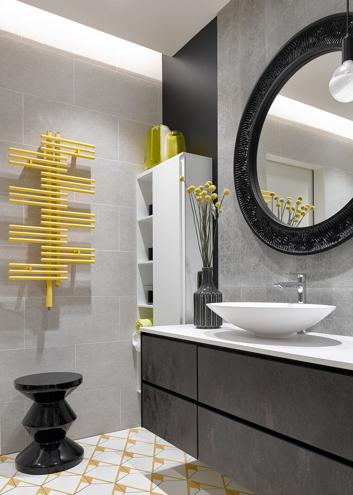 This is an example of a large contemporary grey and yellow bathroom in Moscow with flat-panel cabinets, grey tiles, porcelain tiles, cement flooring, quartz worktops, white worktops, black walls, a vessel sink, brown cabinets and multi-coloured floors.