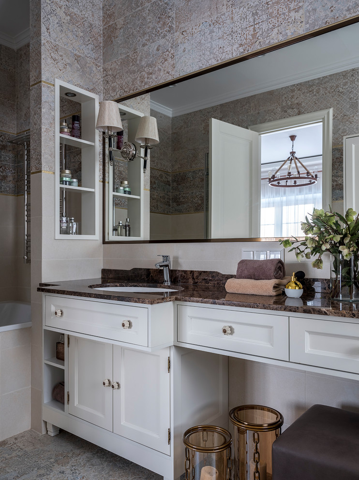 Bathroom - large transitional master gray tile and ceramic tile ceramic tile and gray floor bathroom idea in Moscow with recessed-panel cabinets, white cabinets, a wall-mount toilet, gray walls, an undermount sink, marble countertops, a hinged shower door and brown countertops