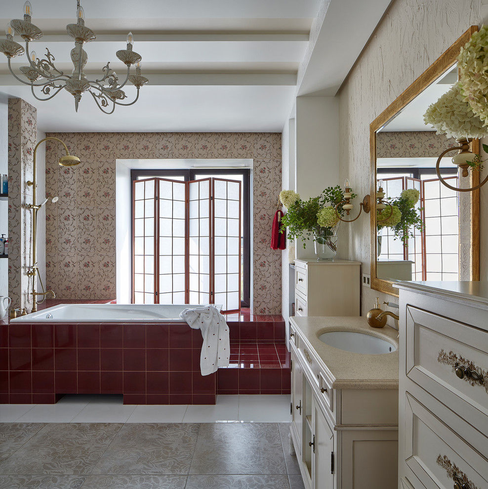 Inspiration for a traditional ensuite bathroom in Yekaterinburg with recessed-panel cabinets, beige cabinets, a built-in bath, a shower/bath combination, beige walls and a submerged sink.