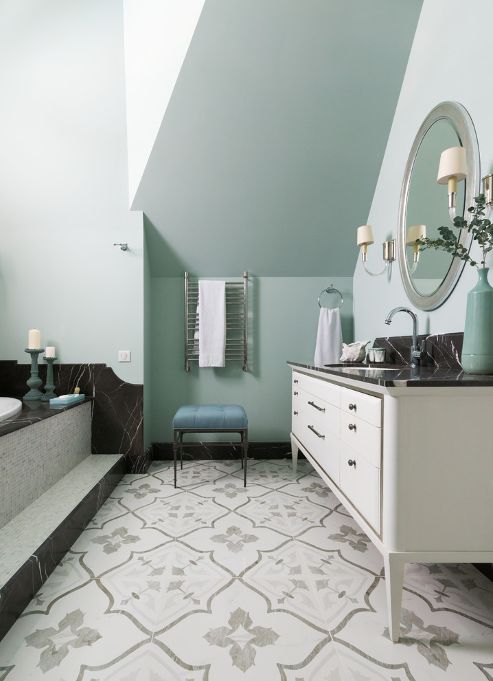 Traditional bathroom in Moscow with white cabinets, a built-in bath, a submerged sink, blue walls, mosaic tile flooring, multi-coloured floors, grey worktops and flat-panel cabinets.