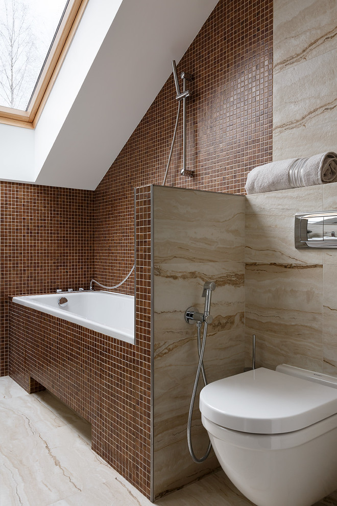 Medium sized contemporary ensuite bathroom in Saint Petersburg with flat-panel cabinets, beige cabinets, a submerged bath, a wall mounted toilet, multi-coloured tiles, mosaic tiles, multi-coloured walls, porcelain flooring and beige floors.