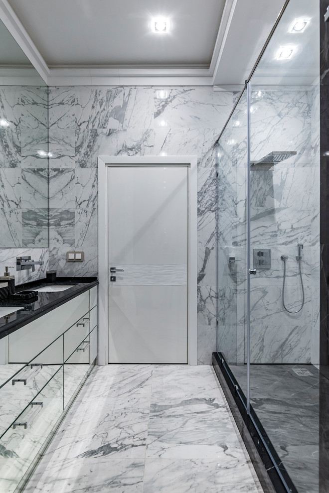 Design ideas for a contemporary shower room bathroom in Moscow with flat-panel cabinets, an alcove shower, white tiles, grey tiles, a submerged sink, grey floors, a hinged door and black worktops.