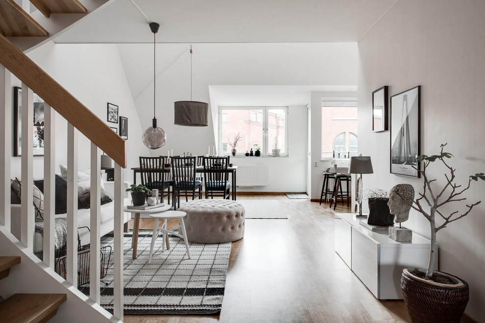 Inspiration for a medium sized scandinavian formal open plan living room in Gothenburg with white walls, light hardwood flooring, no fireplace and no tv.