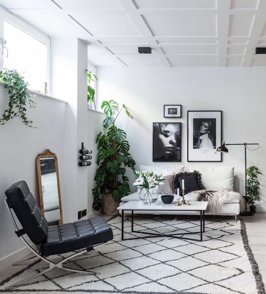 Mid-sized danish formal and open concept light wood floor living room photo in Stockholm with no tv, white walls and no fireplace