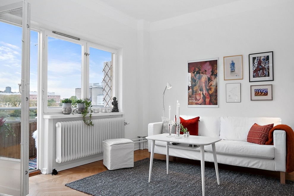 Mid-sized danish formal and open concept light wood floor living room photo in Stockholm with white walls, no fireplace and no tv