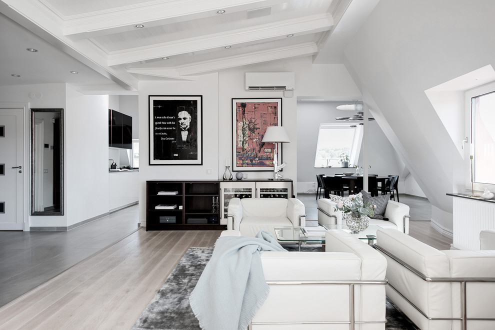Trendy formal and loft-style light wood floor living room photo in Gothenburg with white walls, no fireplace and no tv