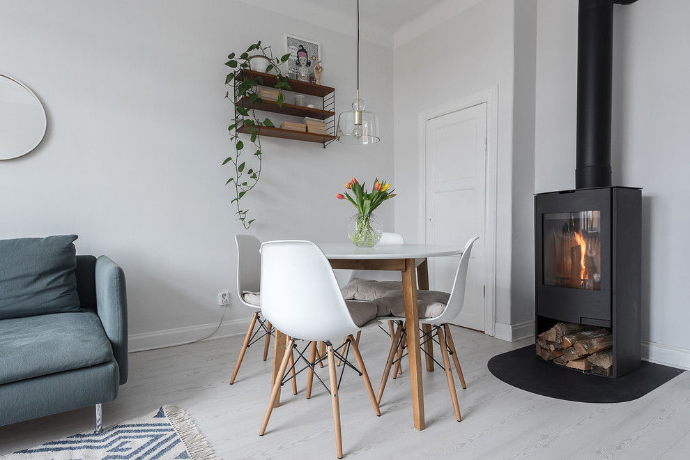 Small scandi open plan living room in Stockholm with white walls.
