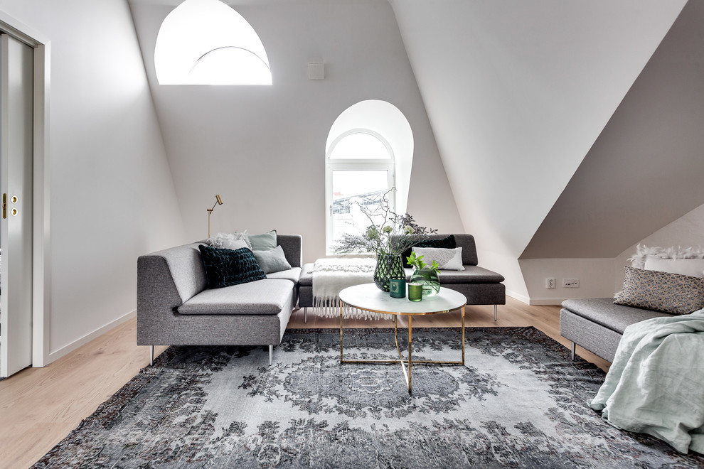Large danish formal and open concept light wood floor living room photo in Stockholm with white walls and no tv
