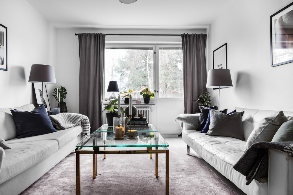 Medium sized scandi formal enclosed living room in Stockholm with white walls and grey floors.