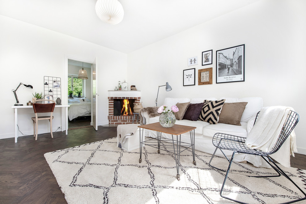 Medium sized scandi formal open plan living room in Stockholm with white walls, dark hardwood flooring, a corner fireplace and a brick fireplace surround.