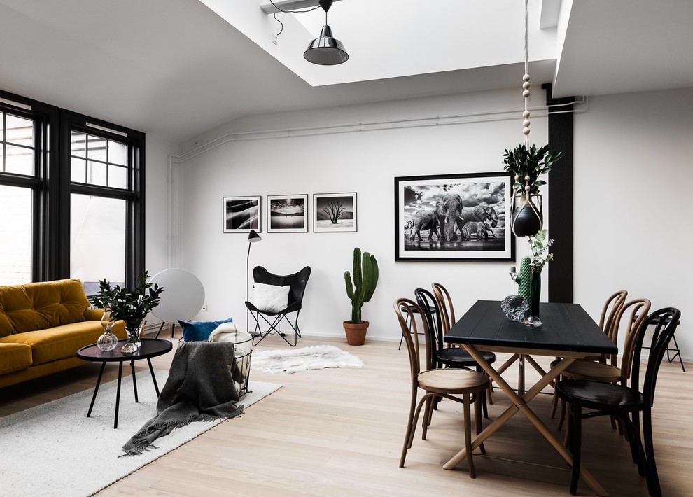 Inspiration for a scandi open plan living room in Stockholm with white walls, light hardwood flooring and beige floors.