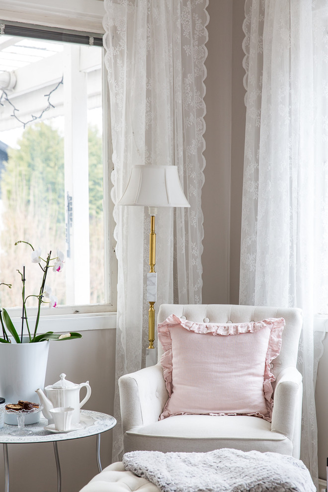 Photo of a shabby-chic style living room in Stockholm.