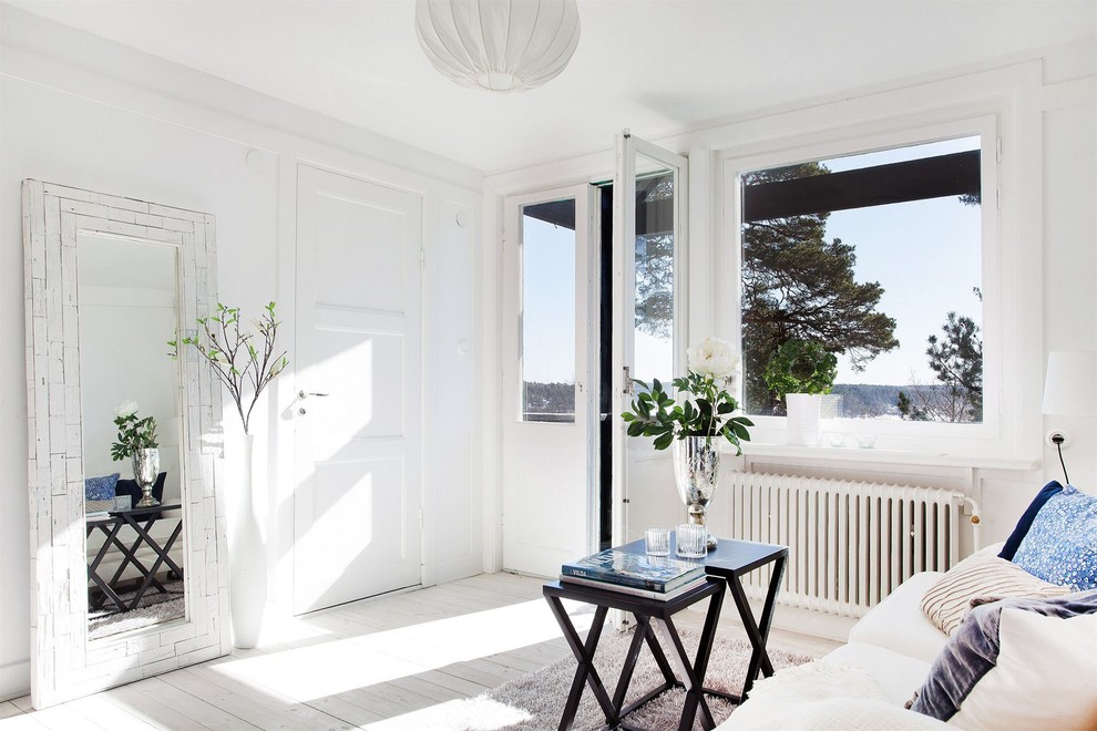 Inspiration for a mid-sized scandinavian formal and enclosed painted wood floor living room remodel in Stockholm with white walls, no fireplace and no tv