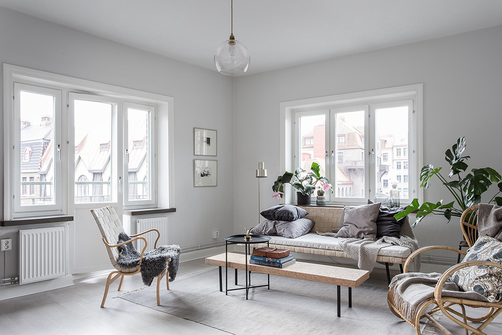 Mid-sized danish formal and open concept light wood floor living room photo in Gothenburg with white walls, no fireplace and no tv