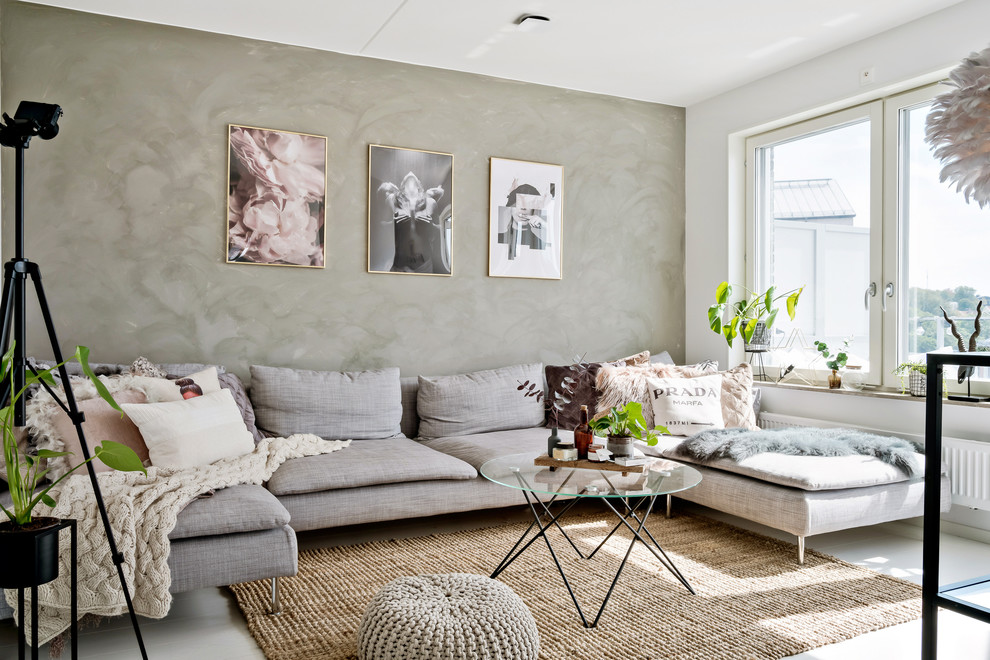 This is an example of a scandi living room in Gothenburg with grey walls.