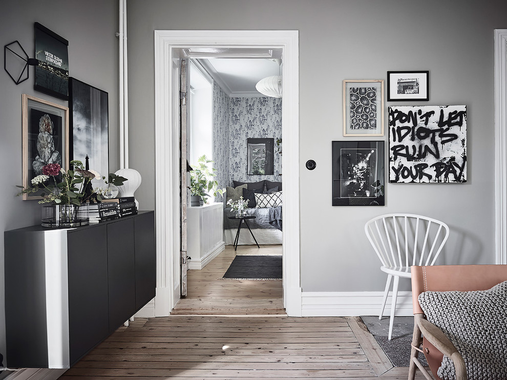 Victorian enclosed living room in Gothenburg with grey walls.