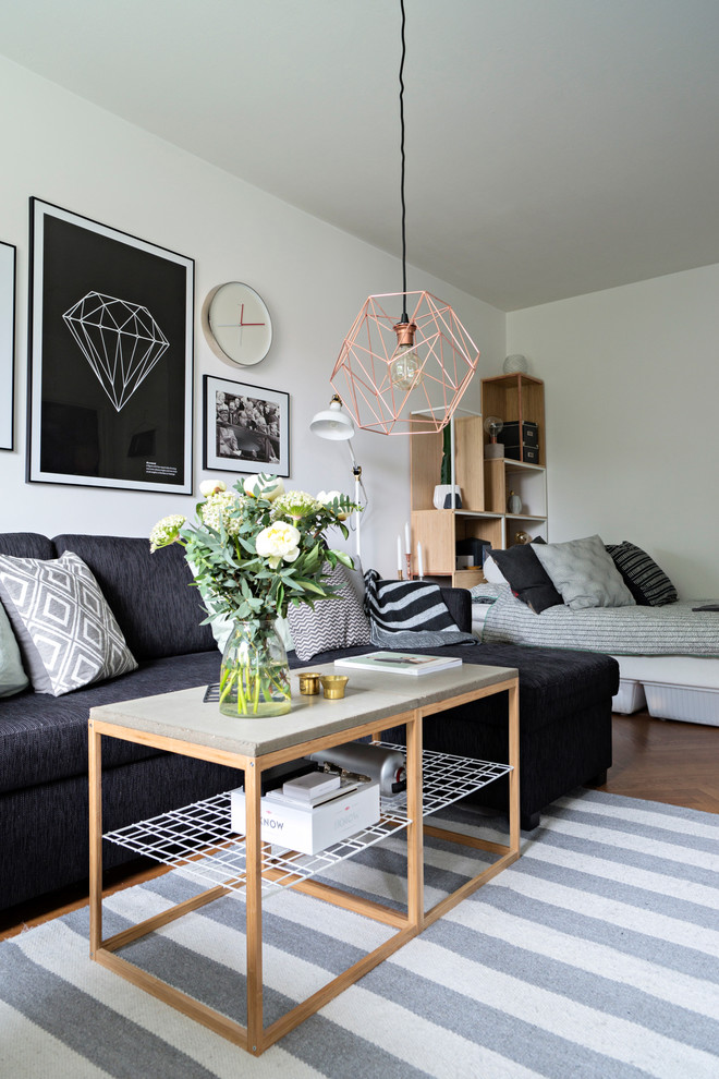Inspiration for a medium sized scandi formal open plan living room in Gothenburg with white walls, medium hardwood flooring and no fireplace.
