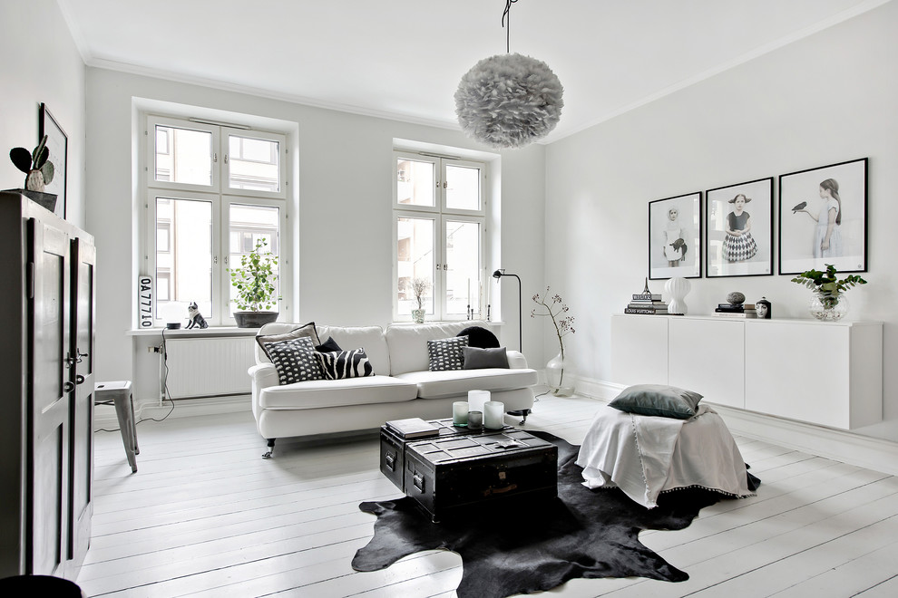 Design ideas for a large scandi formal enclosed living room in Gothenburg with white walls, painted wood flooring, no tv and white floors.