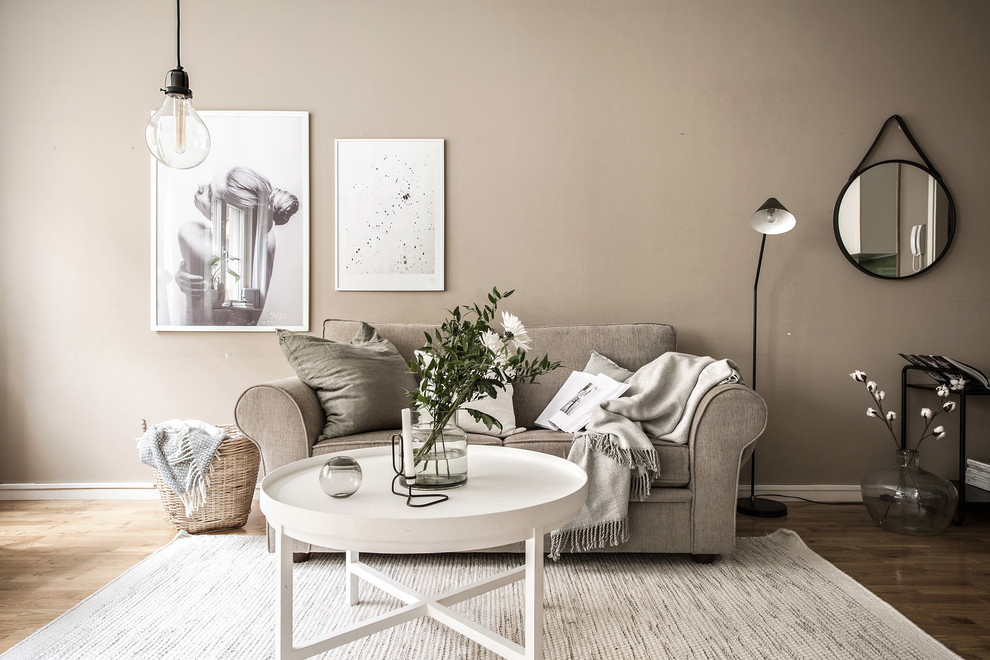 Mid-sized danish enclosed and formal medium tone wood floor and brown floor living room photo in Gothenburg with brown walls