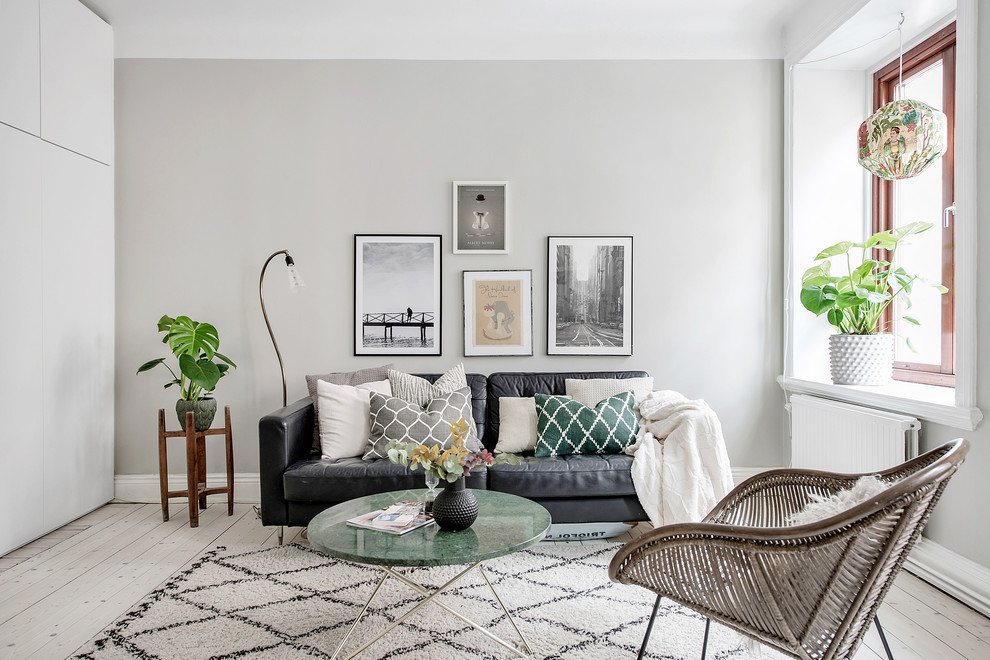 Mid-sized danish enclosed and formal light wood floor and beige floor living room photo in Gothenburg with white walls and no tv