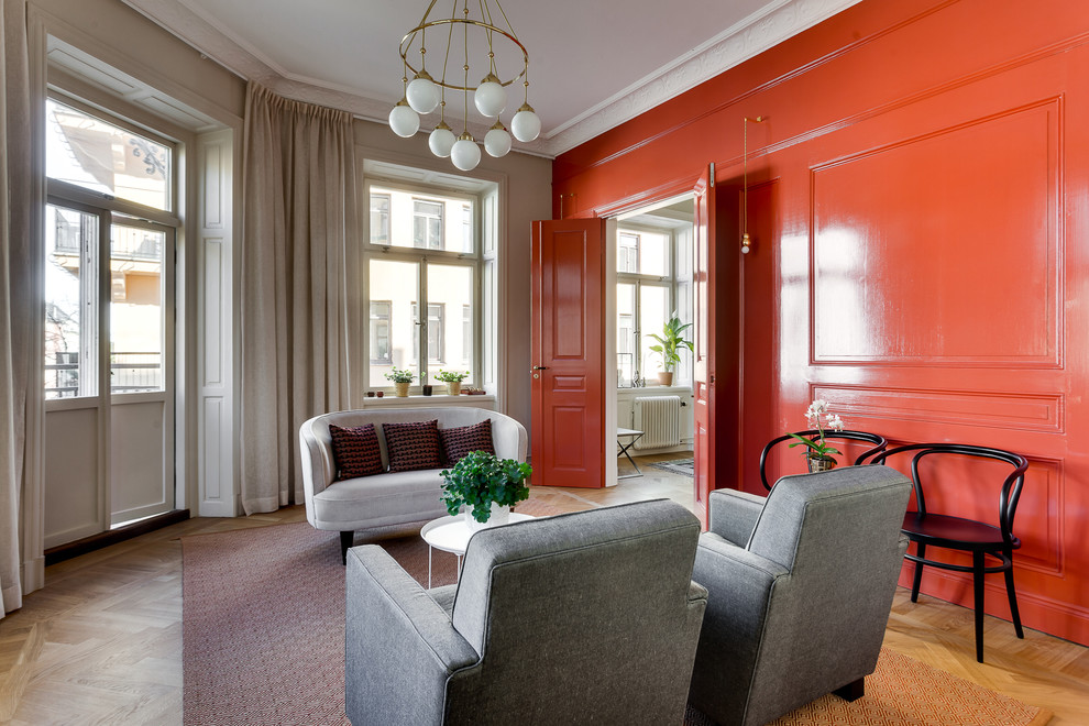 Inspiration pour un salon nordique de taille moyenne avec un mur rouge.
