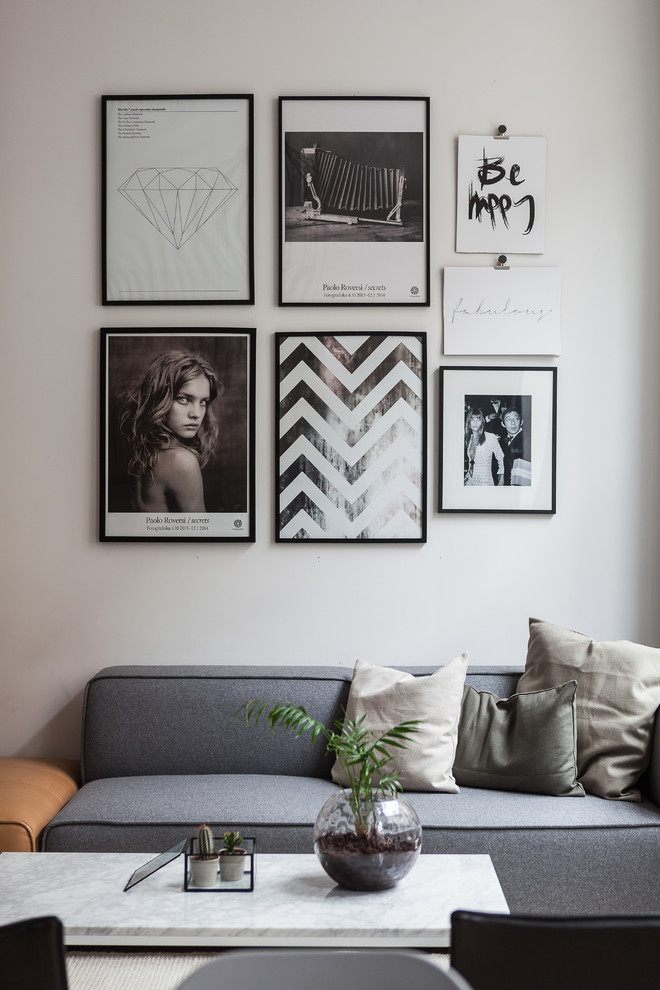 Danish formal and open concept living room photo in Stockholm with white walls and no fireplace