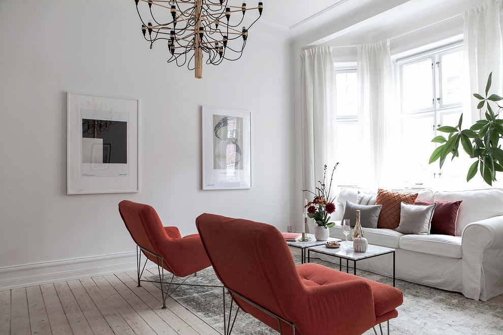 Design ideas for a victorian living room in Malmo with white walls.