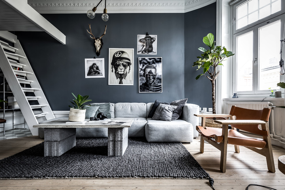 This is an example of a scandinavian grey and white living room in Stockholm.