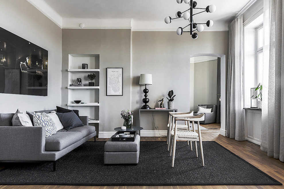Living room - mid-sized scandinavian formal medium tone wood floor and brown floor living room idea in Stockholm with gray walls, no fireplace and no tv