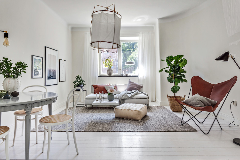 Living room - mid-sized scandinavian open concept painted wood floor and white floor living room idea in Gothenburg with white walls and no fireplace
