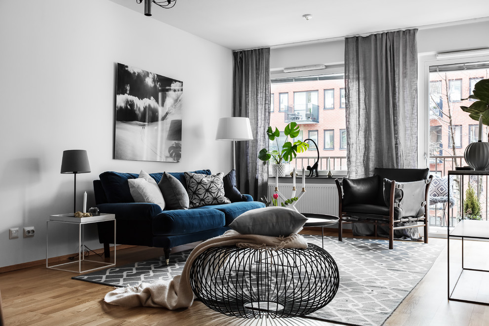 This is an example of a medium sized scandinavian enclosed living room in Stockholm.