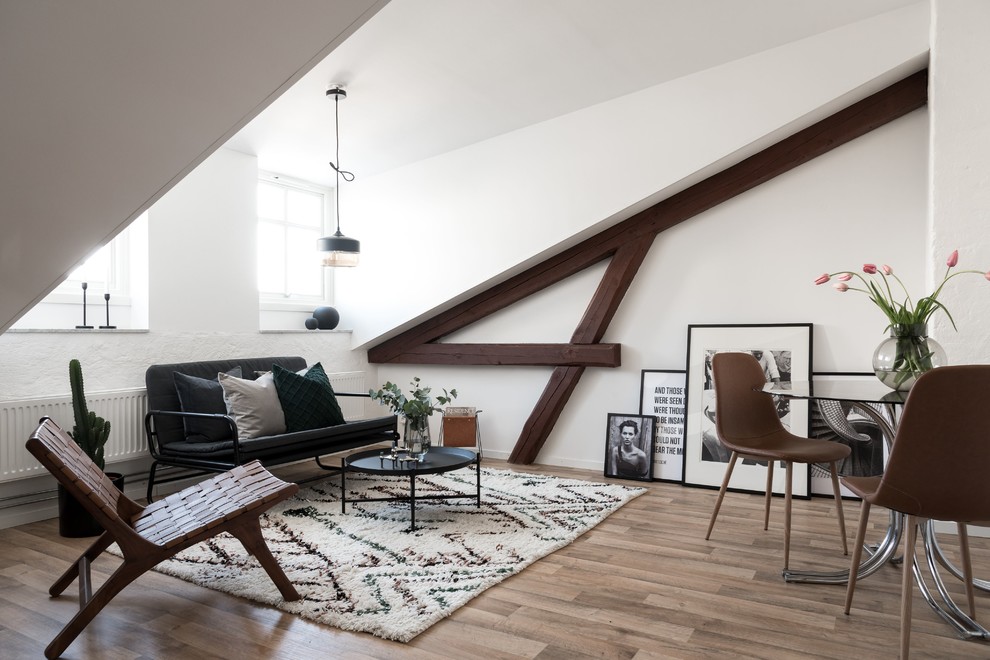 Living room - scandinavian open concept light wood floor and brown floor living room idea in Other with white walls