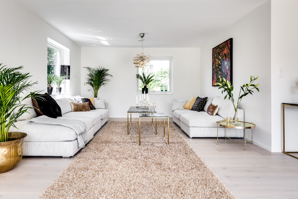 Inspiration for a medium sized contemporary formal enclosed living room in Stockholm with white walls, light hardwood flooring and beige floors.