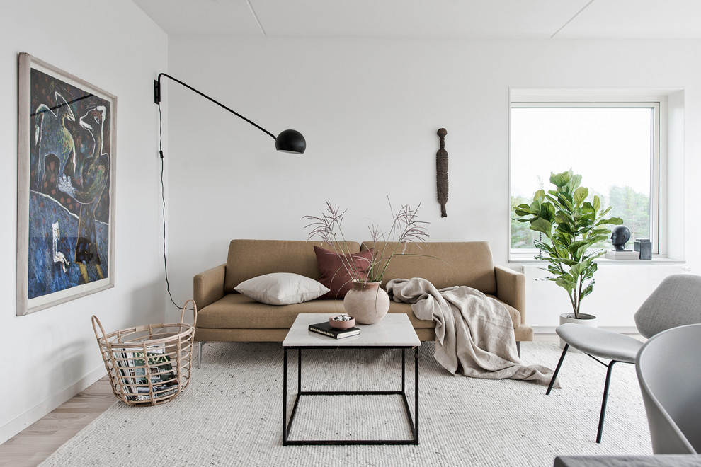 Danish formal and open concept light wood floor and beige floor living room photo in Gothenburg with white walls