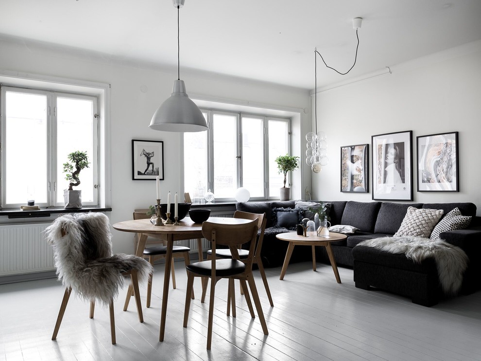 Large danish open concept and formal painted wood floor living room photo in Stockholm with white walls