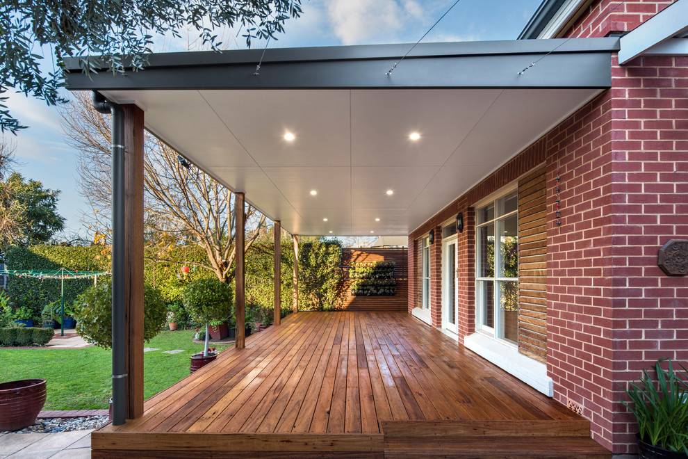 Inspiration for a large contemporary back veranda in Adelaide with a roof extension.