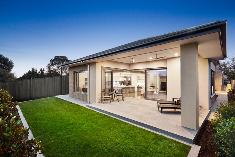 Inspiration for a medium sized contemporary back veranda in Melbourne with concrete paving and a roof extension.
