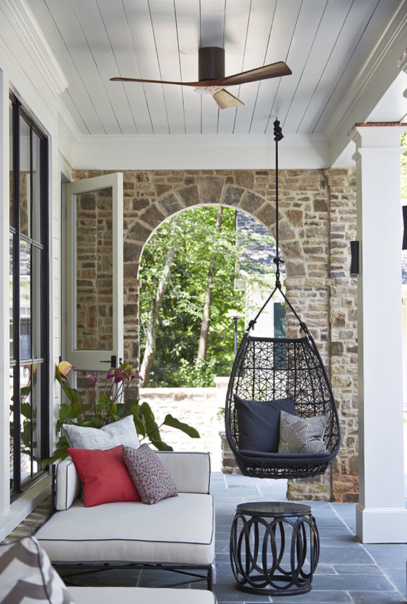 This is an example of a transitional porch design in Atlanta.