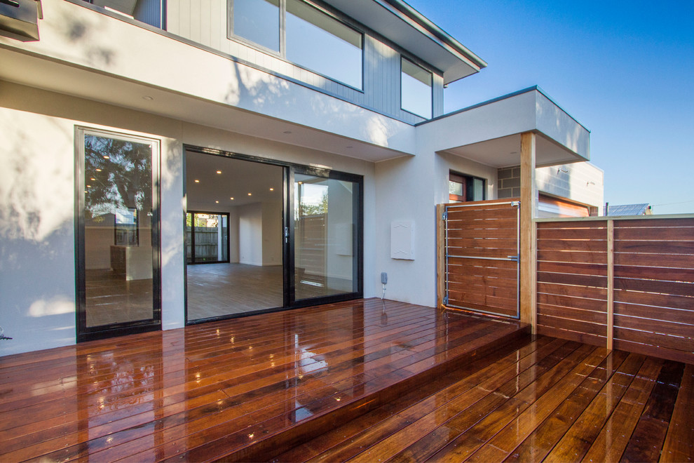 Inspiration for a mid-sized contemporary back porch remodel in Melbourne with decking