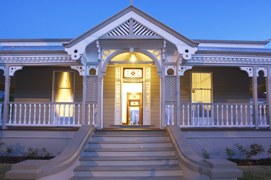 This is an example of a coastal front porch design in Brisbane.