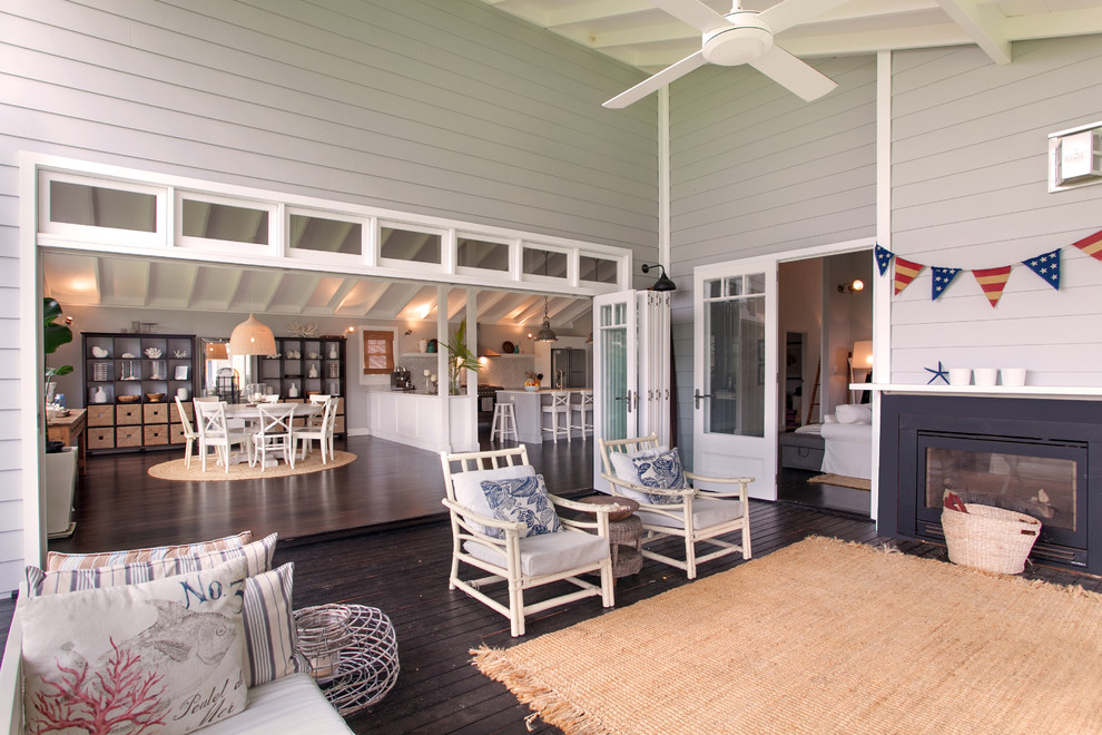 Beach style porch photo in Sydney with a roof extension